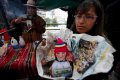 Ярмарка Аласитас в Ла-Пасе (Боливия) помогает исполнить желания. Фото - Juan Karita / AP